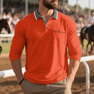 Dettaglio di una polo arancione a maniche lunghe da uomo con tasca sul petto e colletto grigio