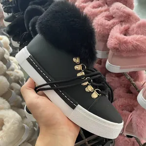 Fashionable black faux leather snow boots with fluffy fur collar and thick platform sole