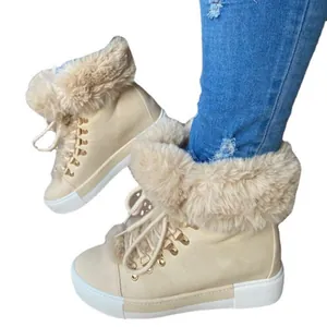 Women's stylish beige winter ankle boots with thick faux fur trim and lace-up front