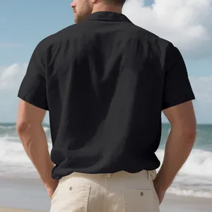 Detailed back view of a men's black linen short sleeve casual shirt in beach setting