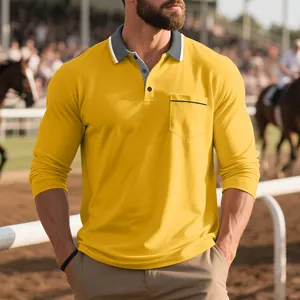 Dettaglio di una polo gialla a maniche lunghe da uomo con tasca sul petto e colletto grigio
