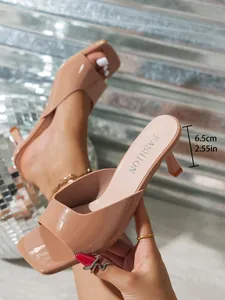Detailed view of nude patent square toe kitten heel sandal with 6.5cm height dimension