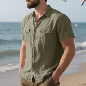 Detail view of olive green linen shirt with front flap pockets at the beach