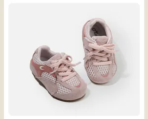 Close-up detail of pink breathable mesh toddler sneakers with soft suede-like finish