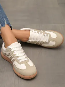 Women's cream and beige German Army Trainer sneakers with lace-up style and gum sole