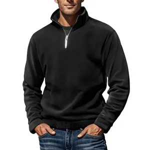Detail of mens black fleece sweatshirt featuring a metal quarter-zip stand collar