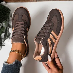 Close-up detail of brown German Army Trainers showing high-quality texture and stitching