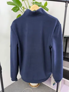 Back view of navy blue men's fleece pullover with cozy stand collar design.