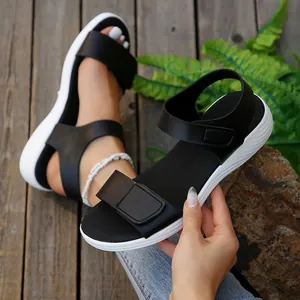 Detailed view of black casual women's platform sandals with adjustable Velcro straps