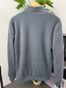 Detailed back view of a gray-blue men's fleece pullover featuring a stand collar.
