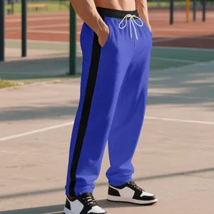 Men's heavy-weight blue joggers with black side stripes and relaxed straight-leg fit.