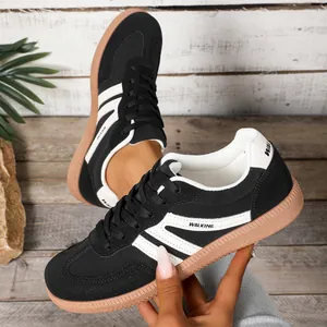 Stylish women's black and white German Army Trainers sneakers with durable gum sole