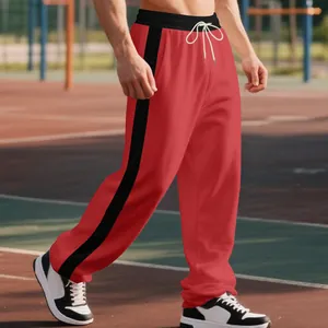 Detail view of men's red heavy fleece relaxed fit sweatpants with black side stripe