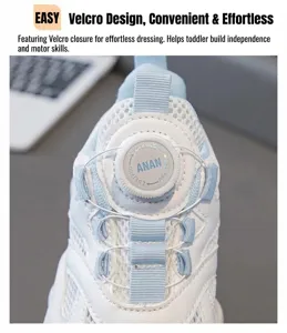Detail view of the rotary dial closure on girls white breathable mesh sneakers