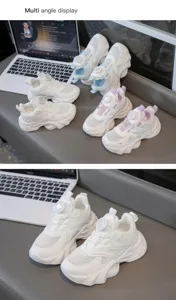 Detail view of white breathable mesh sneakers for girls with rotary buckle closure