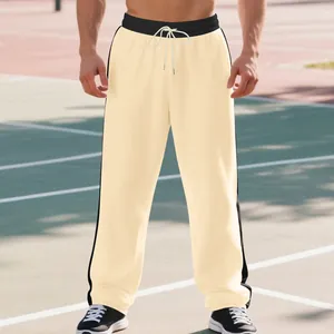 Detail view of cream men's sweatpants with black side stripes and elastic drawstring waist