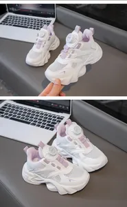 Close-up of breathable mesh texture and rotary buckle system on girls' white sneakers