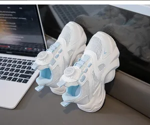 Detail view of girls' breathable mesh sneakers with a convenient rotary buckle