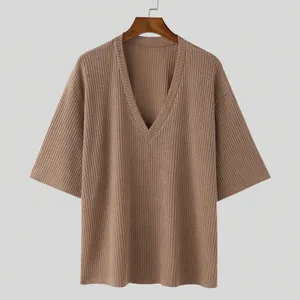 Detailed view of brown ribbed knit V-neck top with comfortable loose mid-sleeves
