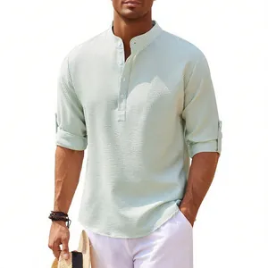 Detailed view of men's striped seersucker shirt with mandarin collar and rolled sleeves.