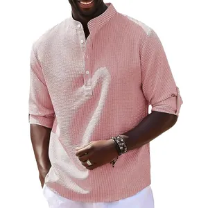 Close-up of men's pink striped Henley shirt with stand collar and rolled-up sleeves detail.