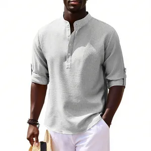 Close-up detail of men's casual long-sleeve stand collar shirt in grey striped fabric