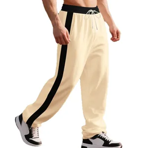Men's heavy weight cream joggers with black side stripes and adjustable drawstring.
