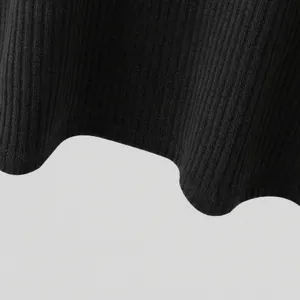 Close-up view of the high-quality black ribbed knit fabric texture for casual t-shirt