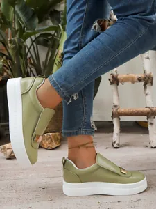 Olive green platform slip-on sneakers with gold buckle and comfortable thick sole design