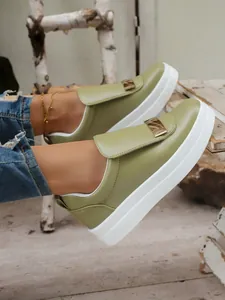 Side view of olive green platform loafers featuring a stylish gold buckle