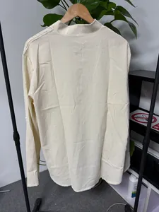 Back view of men's long-sleeve stand-collar shirt showing textured fabric detail