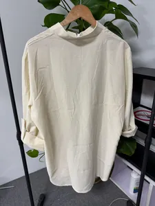 Back view of a men's light yellow striped long-sleeve shirt with a mandarin collar