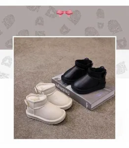 Detail of waterproof children's winter snow boots with a thick warm plush interior lining