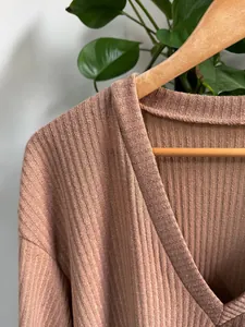 Close-up of ribbed knit V-neck T-shirt showing fabric texture and neckline detail