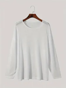 Close-up detail of the lightweight white ribbed texture and loose drop shoulder design