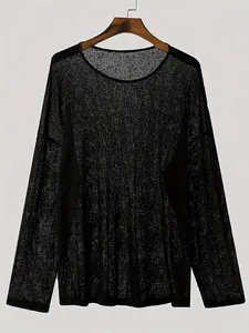 Detailed view of black thin long-sleeve top with vertical textured semi-sheer fabric