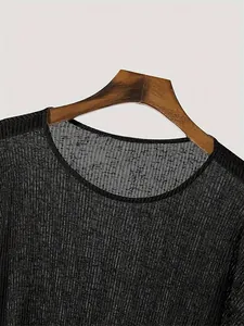 Detailed macro view of black pleated fabric on lightweight round neck long sleeve top