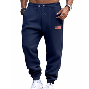 Navy blue men's jogger sweatpants featuring a small American flag embroidery patch