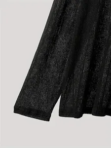 Detail shot of the breathable black ribbed sheer fabric on this casual long sleeve top.