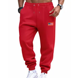 Front view of red men's athletic joggers featuring a small American flag patch on thigh