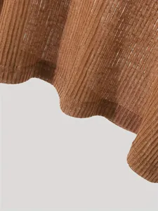 Close-up macro detail of brown ribbed thin breathable knit fabric for summer loose top