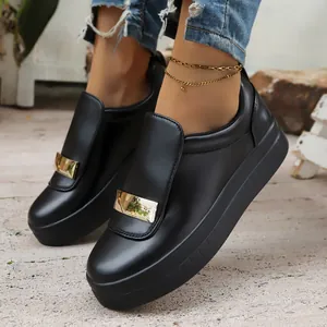 Women's black platform slip-on shoes with gold buckle and comfortable round toe design.