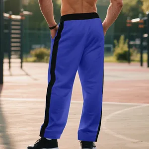 Back view of men's loose blue and black color-block straight-leg heavy fabric sweatpants