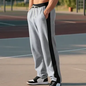 Detail shot of grey men's heavy loopback sweatpants with black contrast side stripes