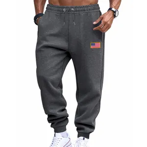 Pantalon de jogging gris pour homme avec écusson drapeau américain et poignets élastiques