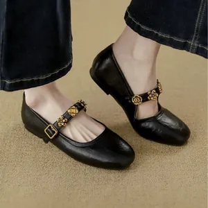 Vintage French style black Mary Jane flats with decorative gold floral buckle strap
