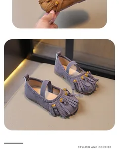 Detailed view of purple suede Mary Jane shoes with elegant fringe and gold beads.