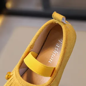 Detail view of yellow suede girls Mary Jane shoes with Fashion insole print