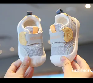 Grey breathable mesh baby walking shoes with soft soles and velcro straps