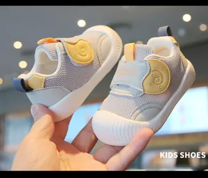Macro view of breathable grey mesh baby toddler shoes with soft anti-slip rubber soles